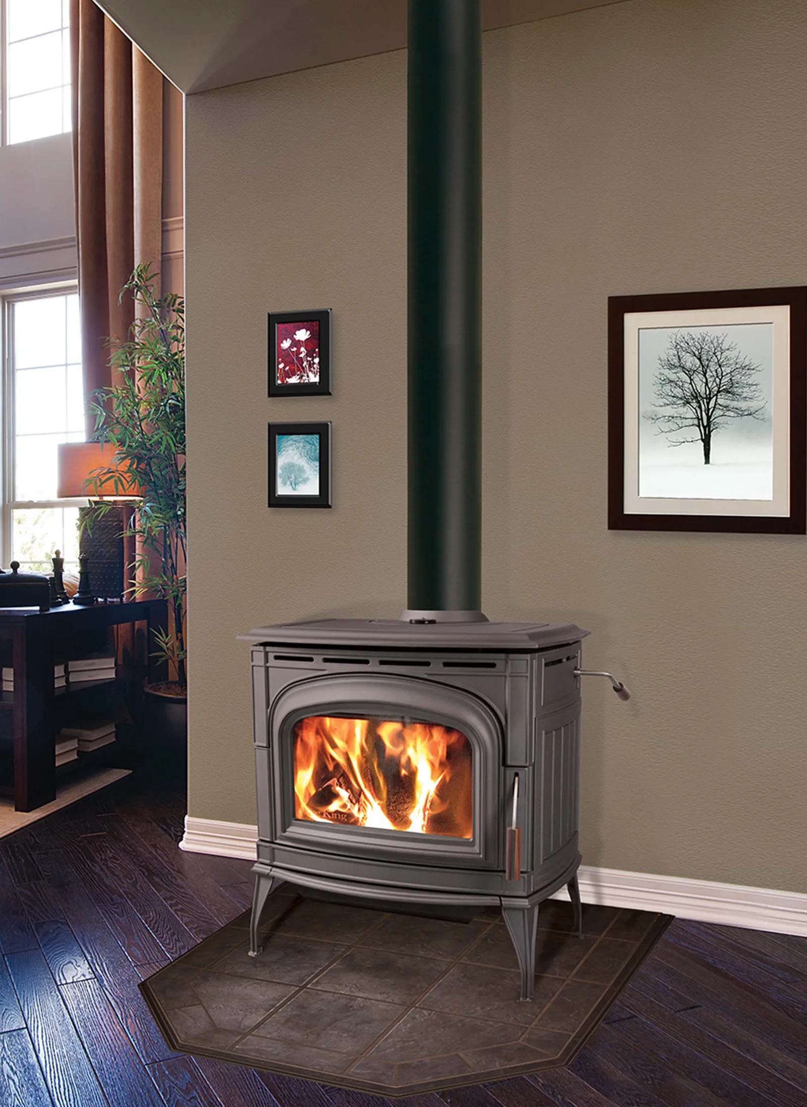 Cast iron wood stove on a tile hearth pad in a living room