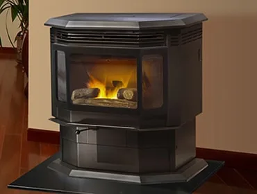 Pellet stove burning in a living room corner