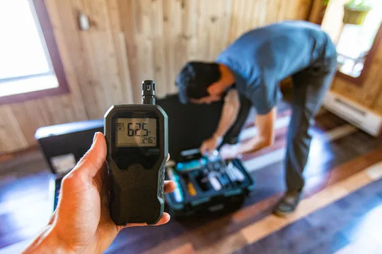 Electrician taking a meter reading during a diagnostic call