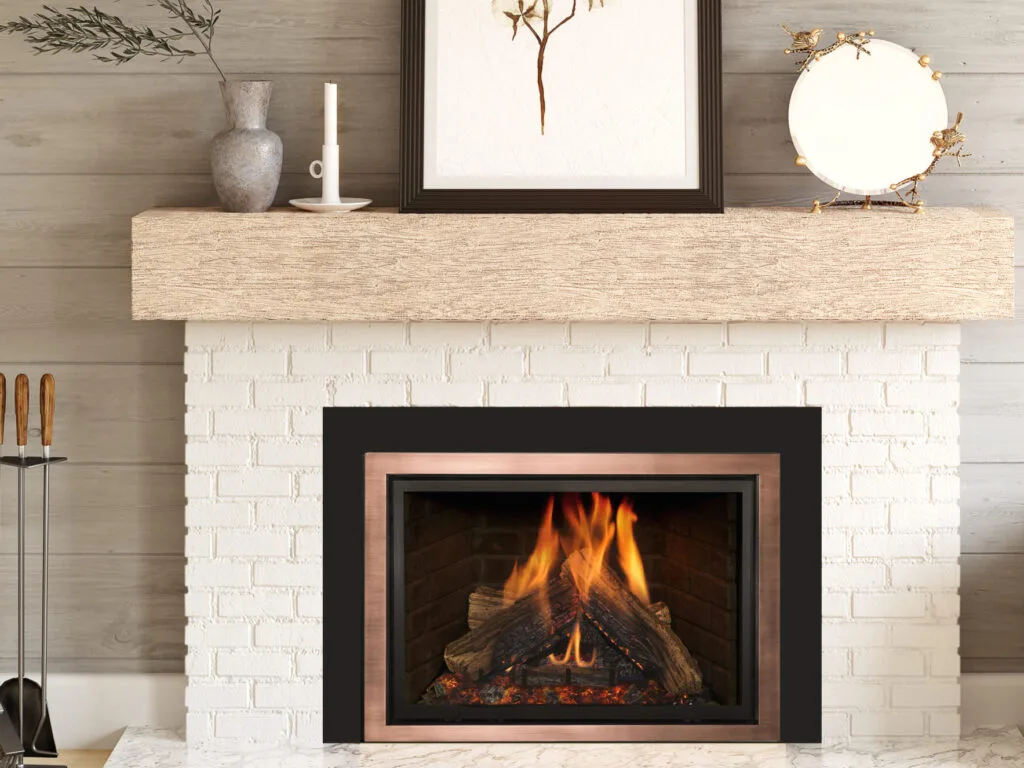 Insert with copper trim in a white brick fireplace