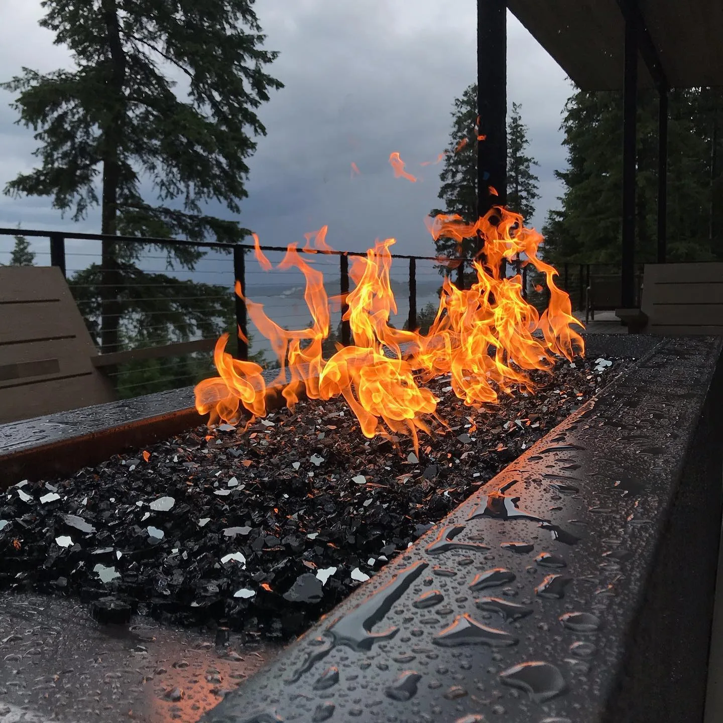 Gas fire pit burning at dusk