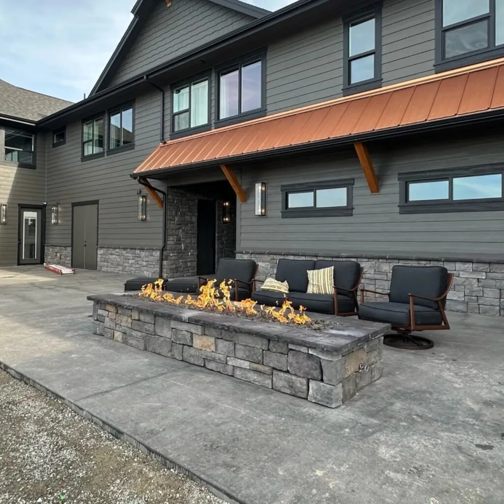Custom gas fire pit on a stone patio